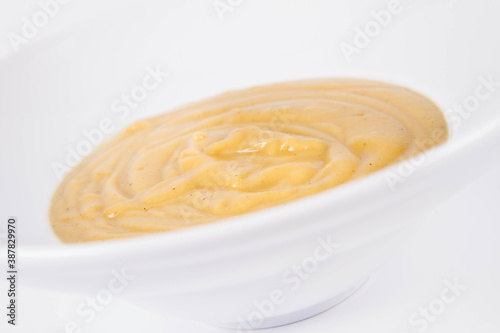 Pumpkin soup on a plate on a white background