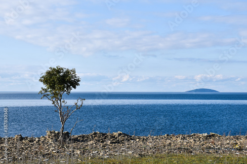 Coastal view at the island Bla Jungfrun in the horizon photo