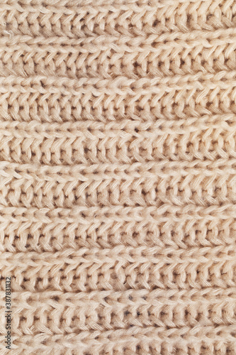 texture of woolen knitted cream scarf