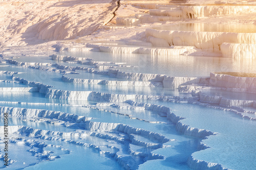 Pamukkale is the main natural wonder of Turkey and the Middle East. White travertines with thermal water. It is a very popular tourist attraction that attracts thousands of tourists. photo