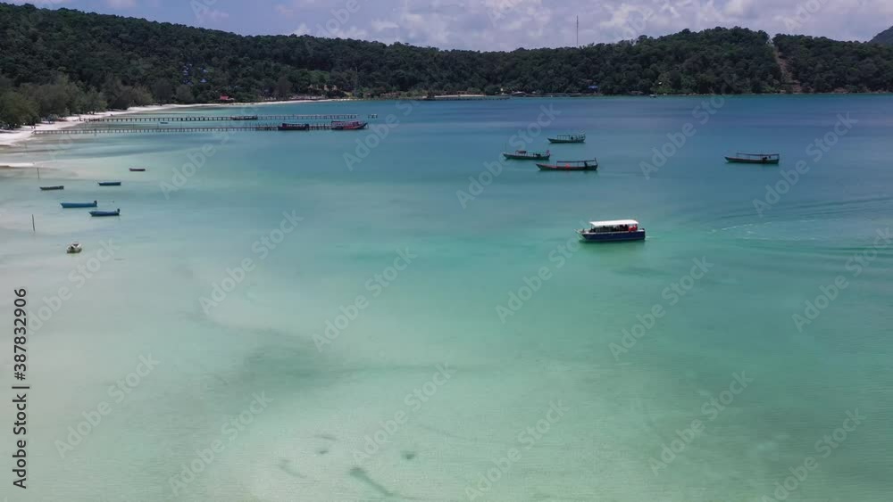 Long deserted beach with white sand and clear water. Aerial top view. island Koh Rong Samloem, Sihanoukville, Cambodia. This is a small island that attracts many vi. White sand beach and calm sea. Long deserted beach with white sand and clear water. Aerial top view. island Koh Rong Samloem, Sihanoukville, Cambodia. This is a small island that attracts many vi. White sand beach and calm sea.
