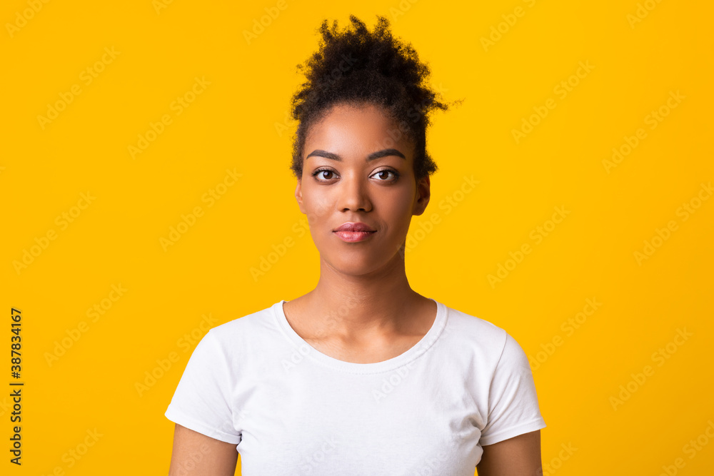 Close up portrait of afro woman looking at camera Close up portrait of afro woman looking at camera
