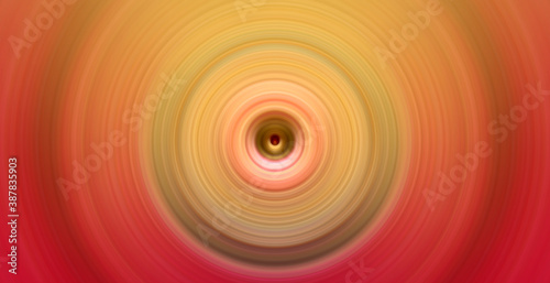 Abstract round orange background. Circles from the center point. Image of diverging circles. Rotation that creates circles.
