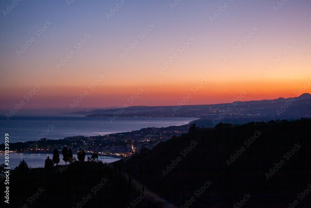 View to Catania and Naxos Bay from Taormina late in the evening, Sicily, Italy