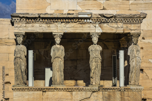 The Erechtheion (or Erechtheum, 406 BC) with Caryatids - ancient Greek temple on the north side of the Acropolis. Erechtheion dedicated to both Athena and Poseidon. Athens, Greece.