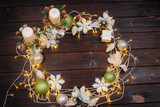 Brown Christmas background decorated with festive Christmas decor and accessories, garland. Festive new year's card