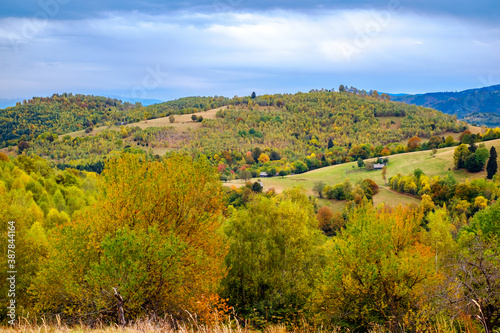 Colorful autumn landscape in the Romanian Carpathians, Fantanele village, Sibiu county, Cindrel mountains, 1100m, Romania