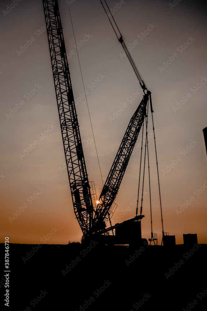 crane in the sunset building windmills in holland 