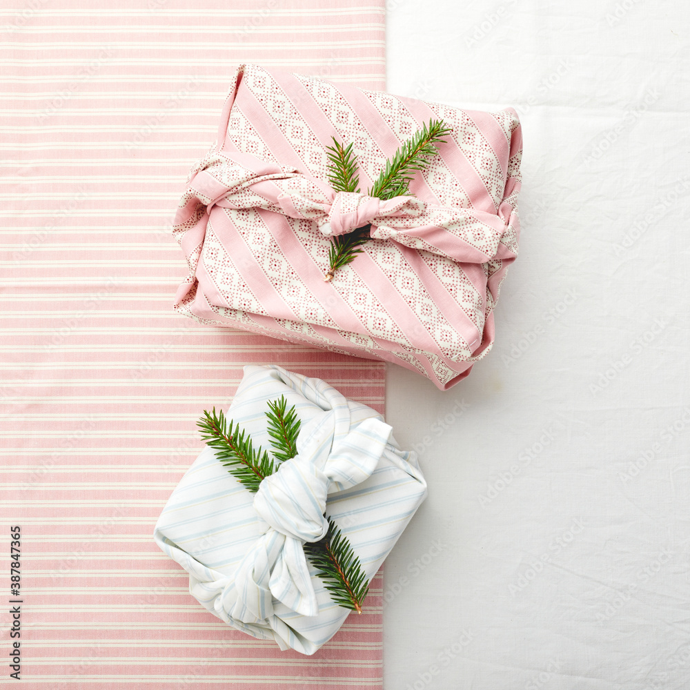 Christmas eco-friendly gift wrap in traditional japanese furoshiki style, eco-friendly gift wrap and Zero Wast concept Christmas eco-friendly gift wrap in traditional japanese furoshiki style, eco-friendly gift wrap and Zero Wast concept