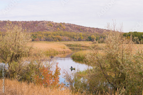 fisherman in a boat on the river