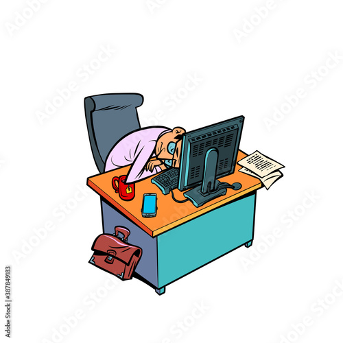 sleepy tired male businessman works at an office workplace at a computer