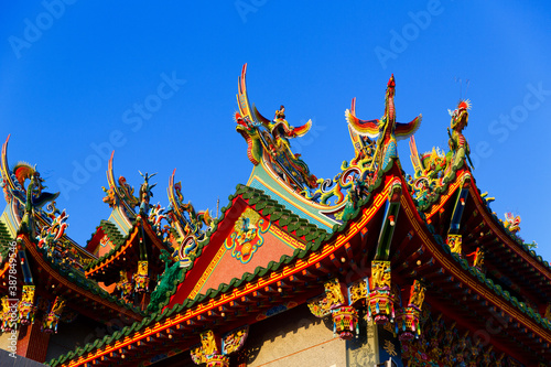 Tainan, Taiwan, October 12, 2019 Colorful roofs of a Taiwanese temple decorated with sculptures of sacred animals ( dragons and lions) in traditional mosaic art