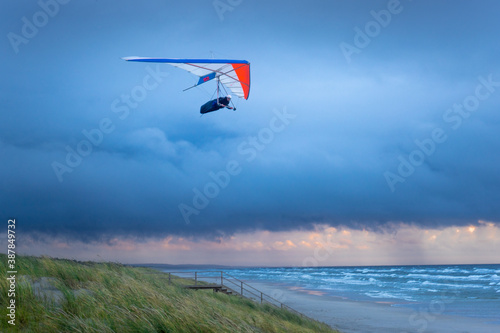 hang glider flying in the sky