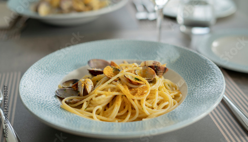 spaghetti pasta with clams and bottarga, Mediterranean food photo