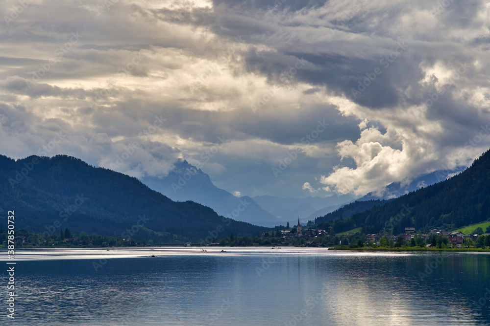 Dramatic sky and sunset lake Weissensee Austria