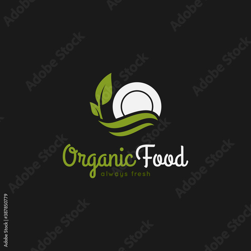 Organic food logo. Plate with leaf on black