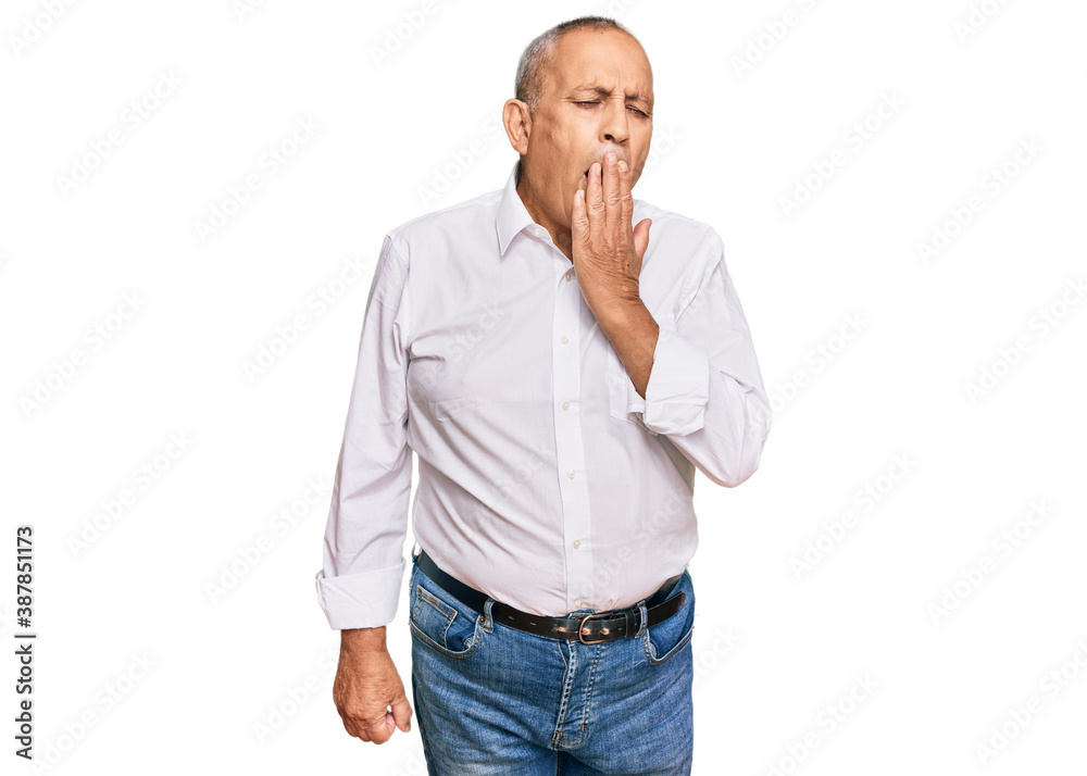 Handsome senior man wearing elegant white shirt bored yawning tired covering mouth with hand. restless and sleepiness. Handsome senior man wearing elegant white shirt bored yawning tired covering mouth with hand. restless and sleepiness.
