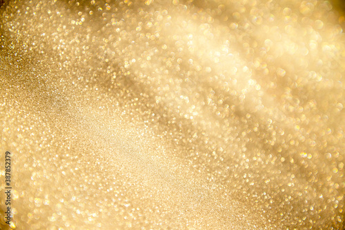 abstract defocused lights, sparkling holiday bokeh background with golden tones, elegant christmas backdrop