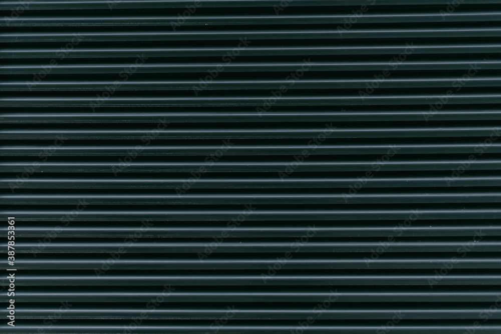 Texture. Building wall or closed blinds on a window. Metal horizontal flats Texture. Building wall or closed blinds on a window. Metal horizontal flats