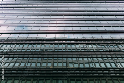 Texture. High-rise office building windows and sky. Skyscraper windows