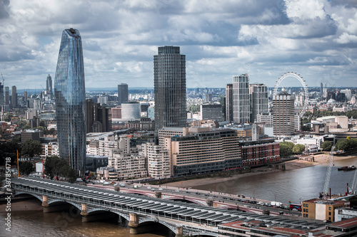 City of London view, business and office area, river Thames and London bridges with traffic.
