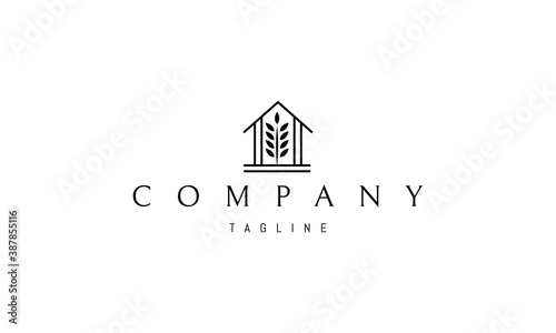 Vector logo on which an abstract image of a barn with a silhouette of an ear of wheat in the middle.