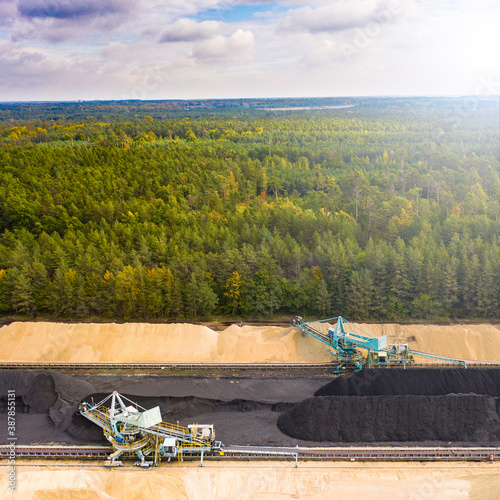 Obraz na płótnie industrial sustainability - mining industry - green nature background w salonie