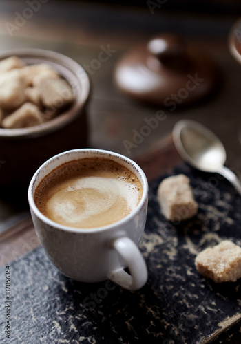 Fototapeta Naklejka Na Ścianę i Meble -  Cup of coffee on rustic wooden background. Close up