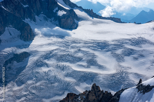 Beautiful blue morning landscape with  glacier on the Mont Blanc massif from Aiguille du Midi 3842m, Chamonix, France photo