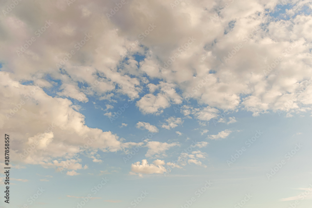 abstract background of white fluffy clouds on a bright blue sky