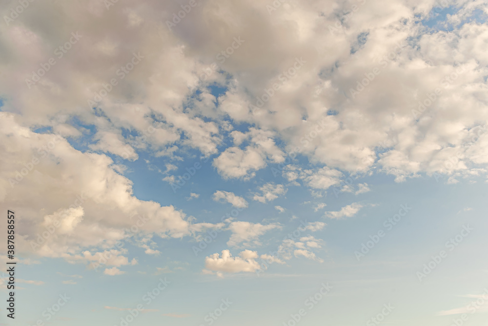 abstract background of white fluffy clouds on a bright blue sky abstract background of white fluffy clouds on a bright blue sky
