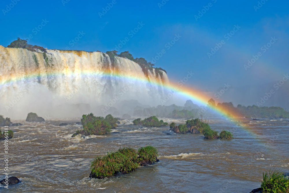 Fototapeta premium Rainbow Spanning the Rapids Beneath the Falls