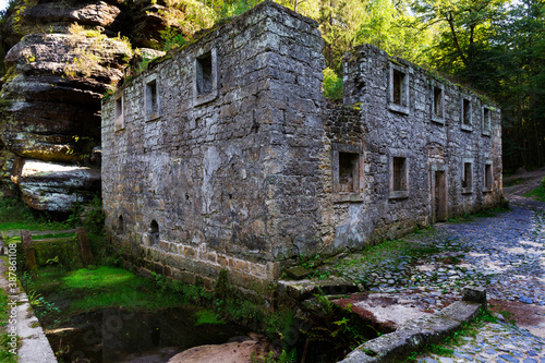 Ruin of Dolsky Mill from 18th century on the River Kamenice in Bohemian Switzerland, Czech Republic photo