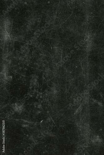 Old vintage texture of black matte scratched surface