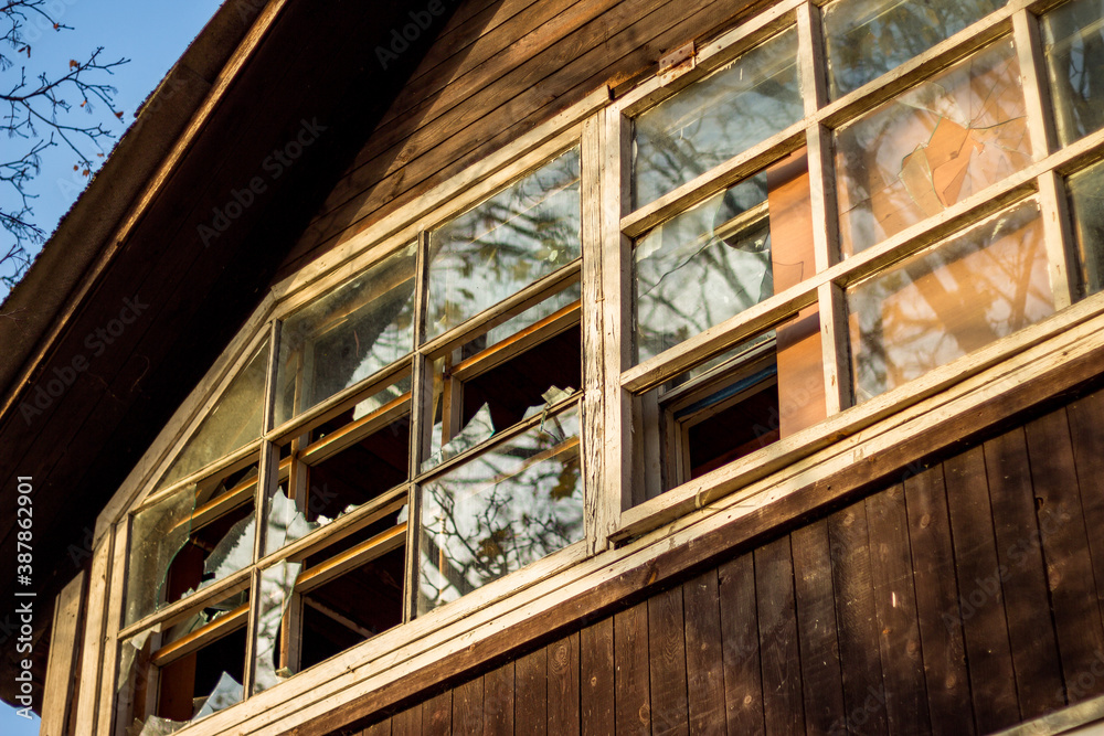 Fototapeta premium Broken window panes in a country wooden house 