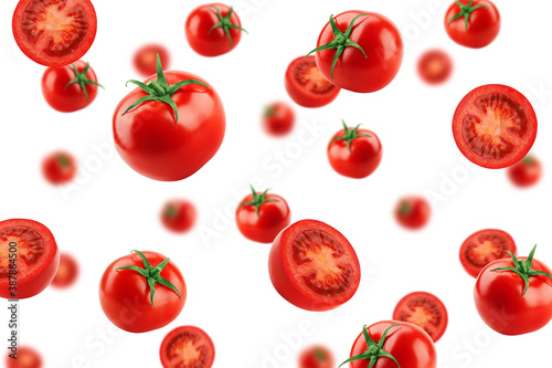 Falling tomato isolated on white background, selective focus © grey