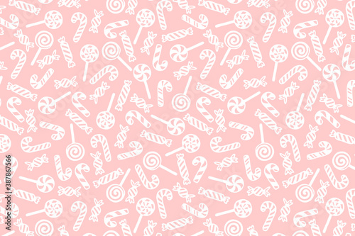 Vector Christmas background with hand drawn lollipops, candy canes and candies.