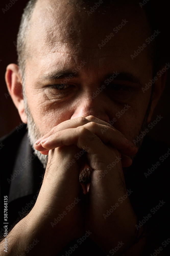 portrait of a old man praying portrait of a old man praying
