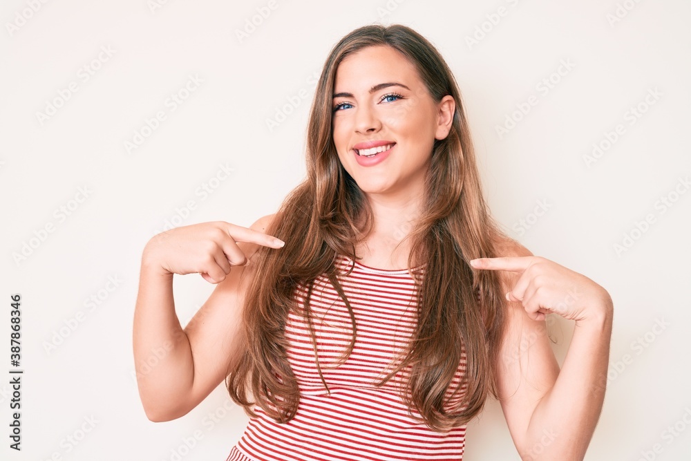 Beautiful young caucasian woman wearing casual clothes looking confident with smile on face, pointing oneself with fingers proud and happy. Beautiful young caucasian woman wearing casual clothes looking confident with smile on face, pointing oneself with fingers proud and happy.