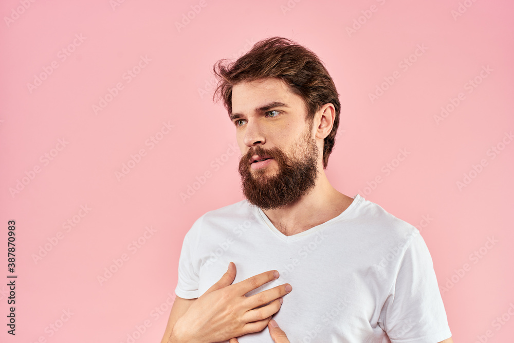 Bearded man white t-shirt cropped view lifestyle studio pink background Bearded man white t-shirt cropped view lifestyle studio pink background
