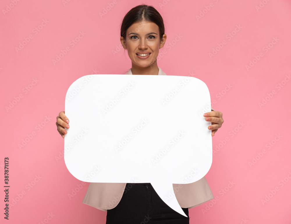 cute businesswoman holding a speech bubble and smiling cute businesswoman holding a speech bubble and smiling