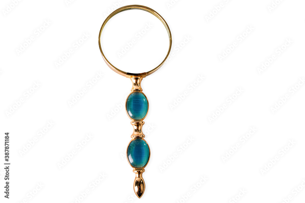 A gold with precious stones magnifying glass on white background, isolated. A gold with precious stones magnifying glass on white background, isolated.