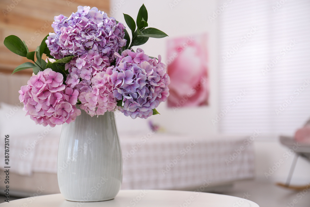 Bouquet of beautiful hydrangea flowers on table in bedroom, space for text. Interior design Bouquet of beautiful hydrangea flowers on table in bedroom, space for text. Interior design