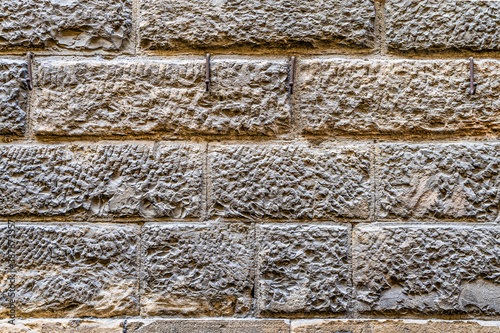 Canvastavla Wall of a medieval building in the city center of Florence, Tuscany, Italy, made of local sandstone known as pietra forte