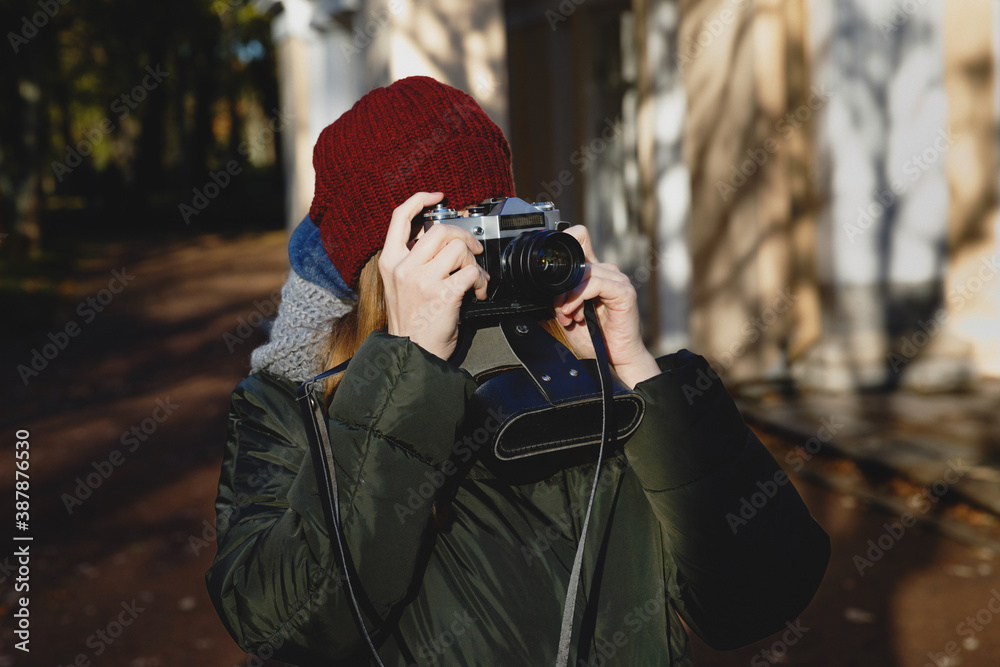hipster with film camera. Photographer's walk in the park. hipster with film camera. Photographer's walk in the park.