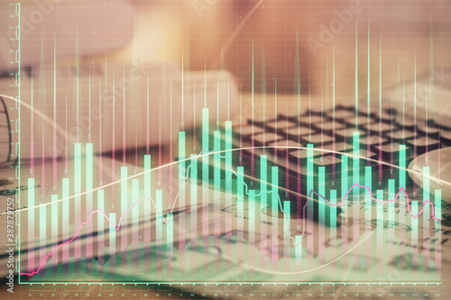 Double exposure of financial chart drawings and desk with open notebook background. Concept of forex market © peshkova