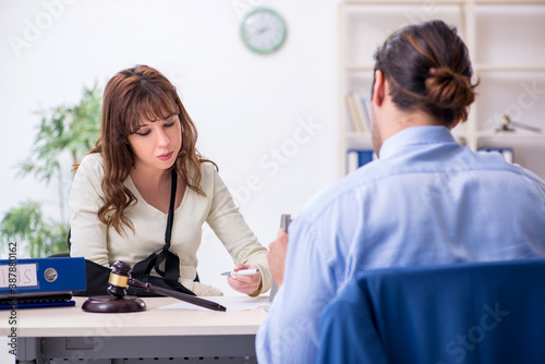 Injured woman and male judge in the courtroom