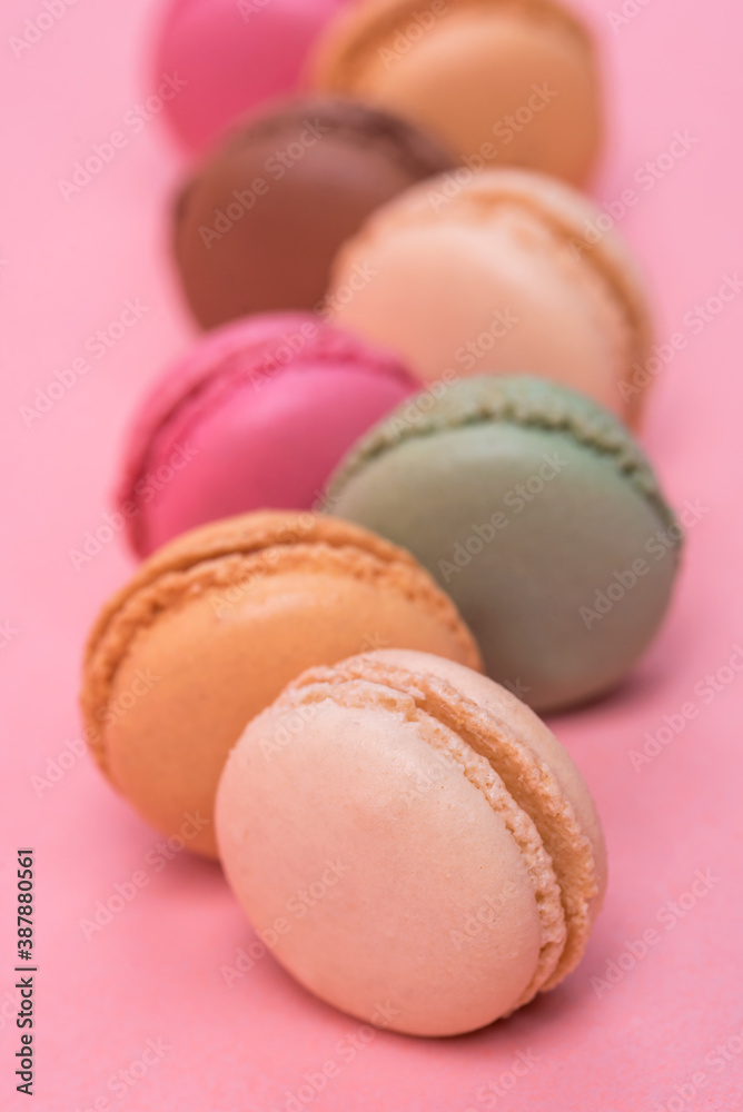 Delicious and colourful macaroons on pink background Delicious and colourful macaroons on pink background