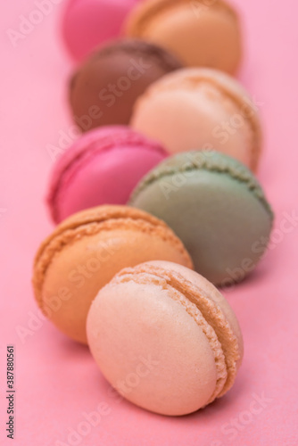 Delicious and colourful macaroons on pink background © Anetta