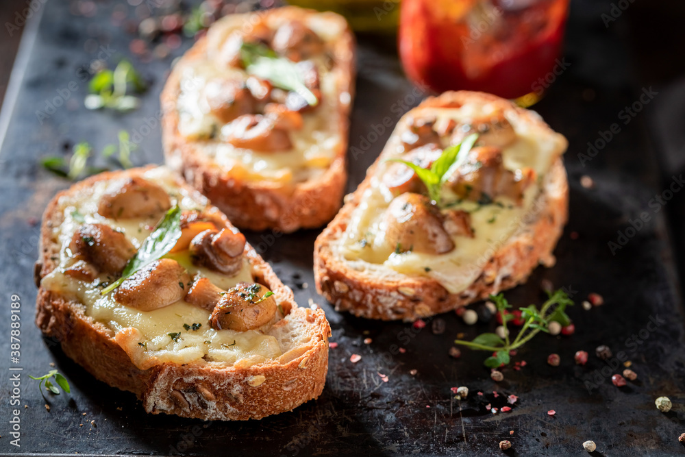 Tasty Toast with mushrooms, cheese and olive oil